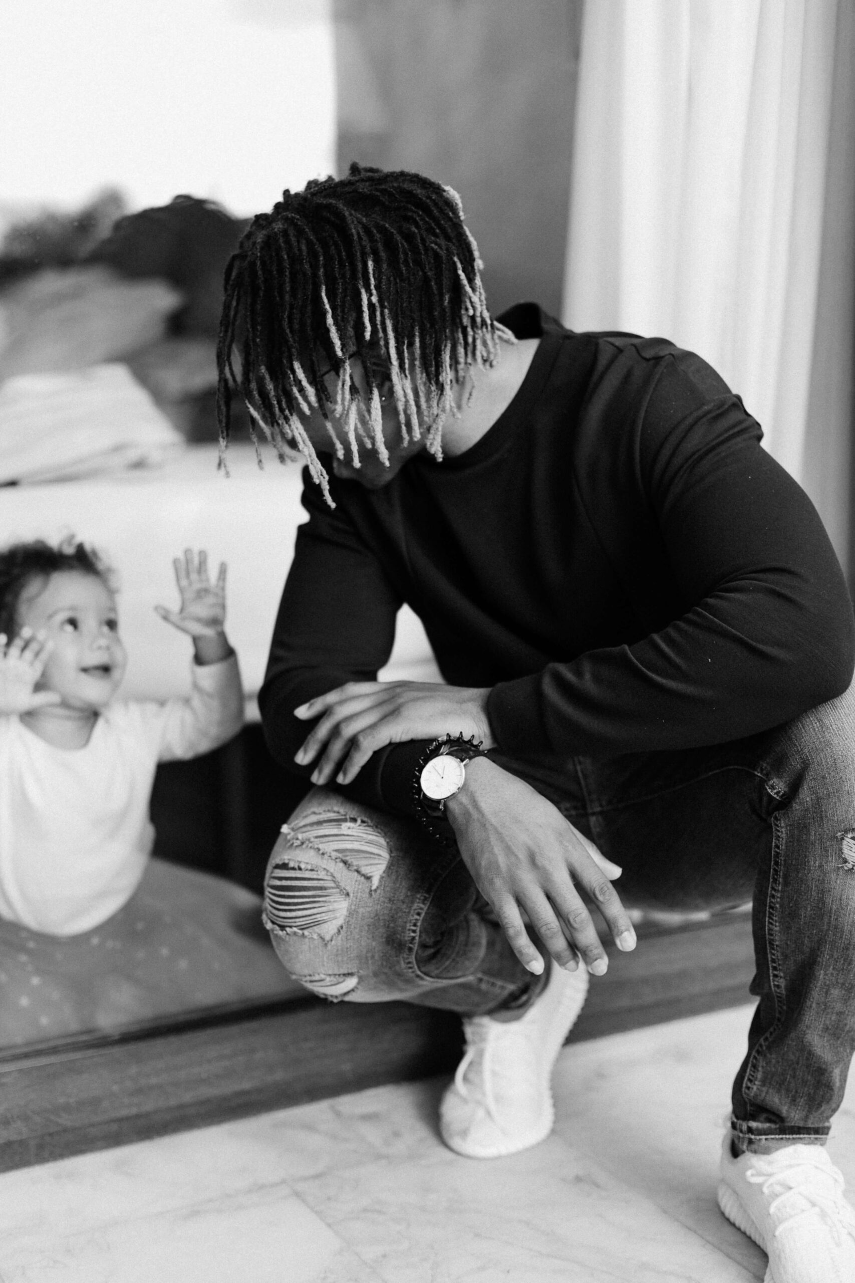 father sitting on stairs with child