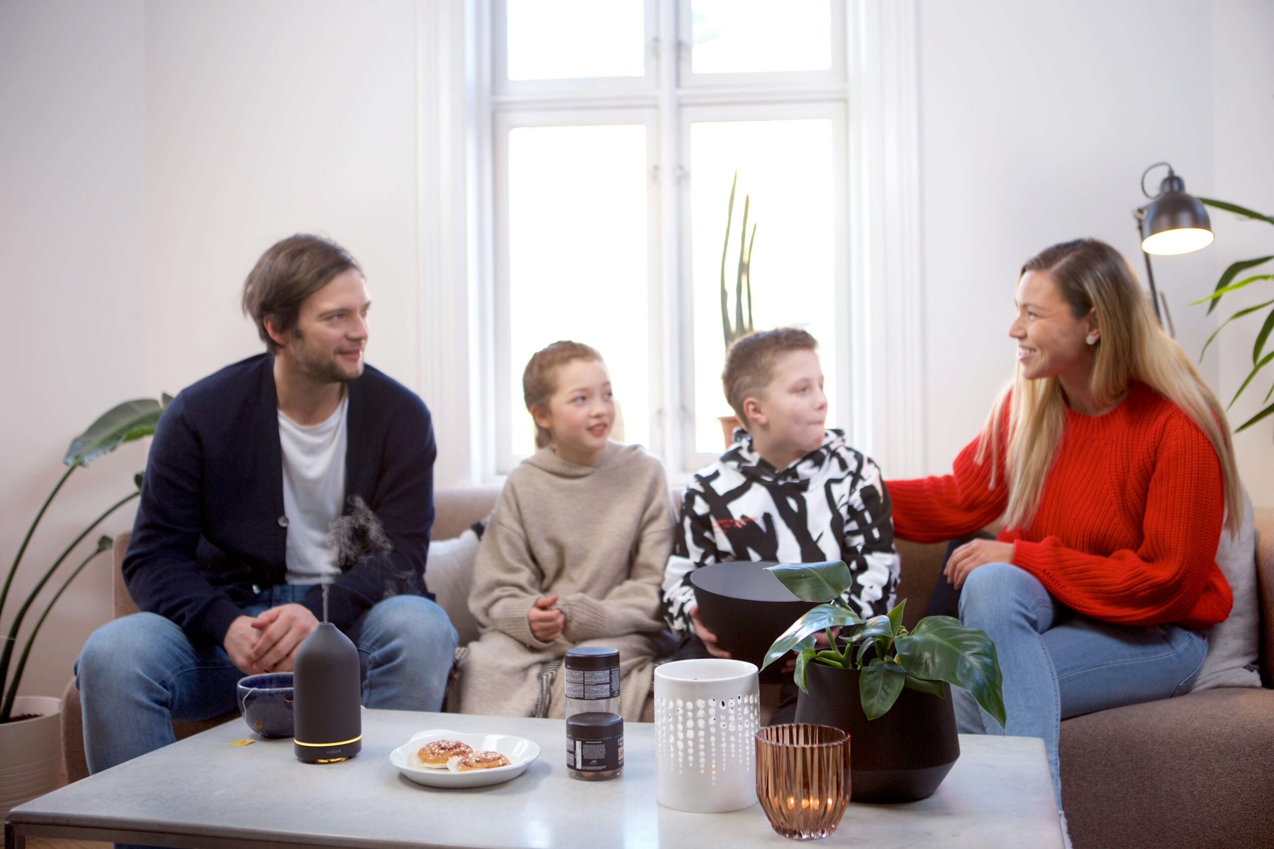 separating parents speaking with children on couch